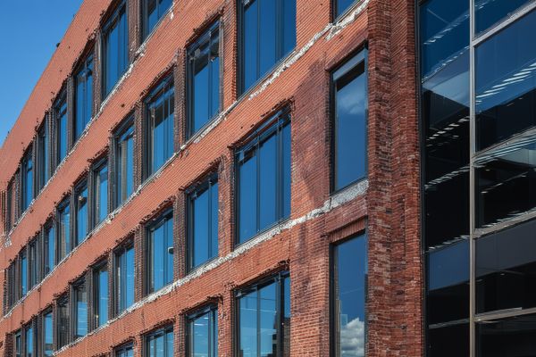Modern office building with glass and brick facade showing contemporary commercial architecture