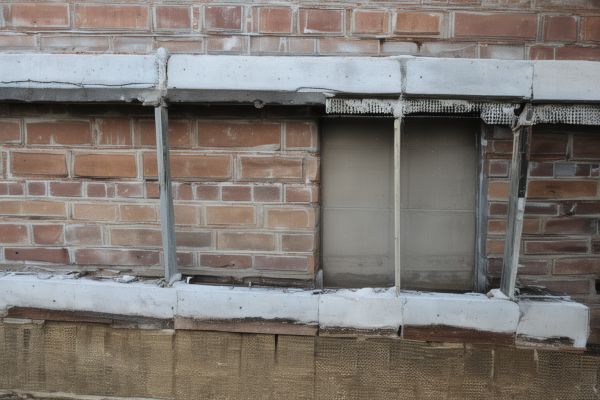 Masonry foundation repair showing proper structural support and waterproofing techniques